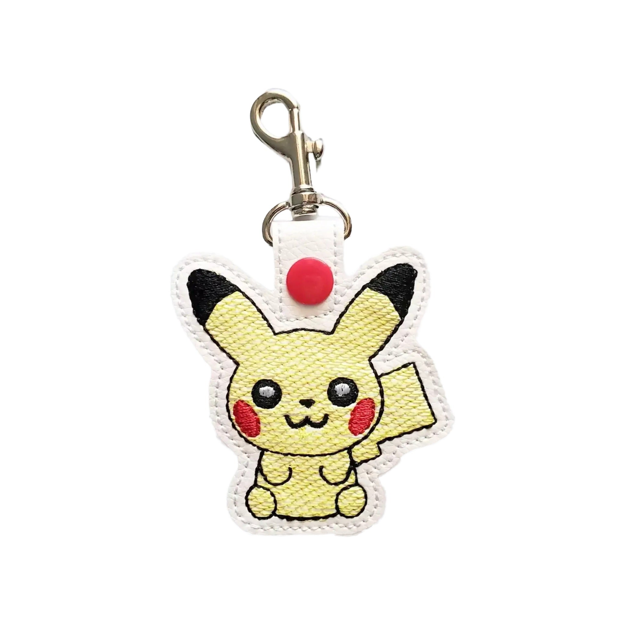A keychain featuring a cartoon-style Pikachu character with a red button on its ear.