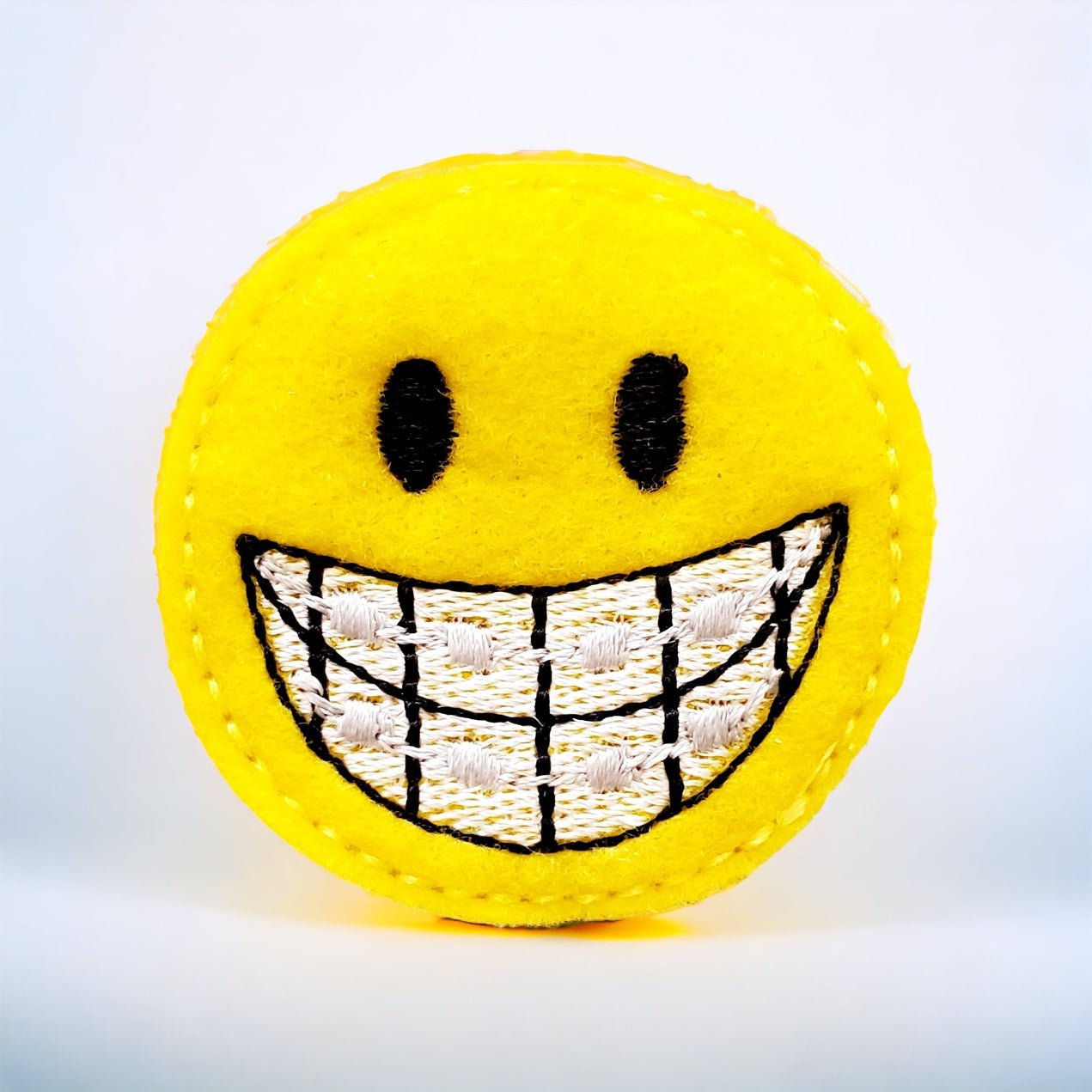 Felt – Smiley Face Braces Orthodontist Badge Topper + Reel - | Happie Potato Image 1