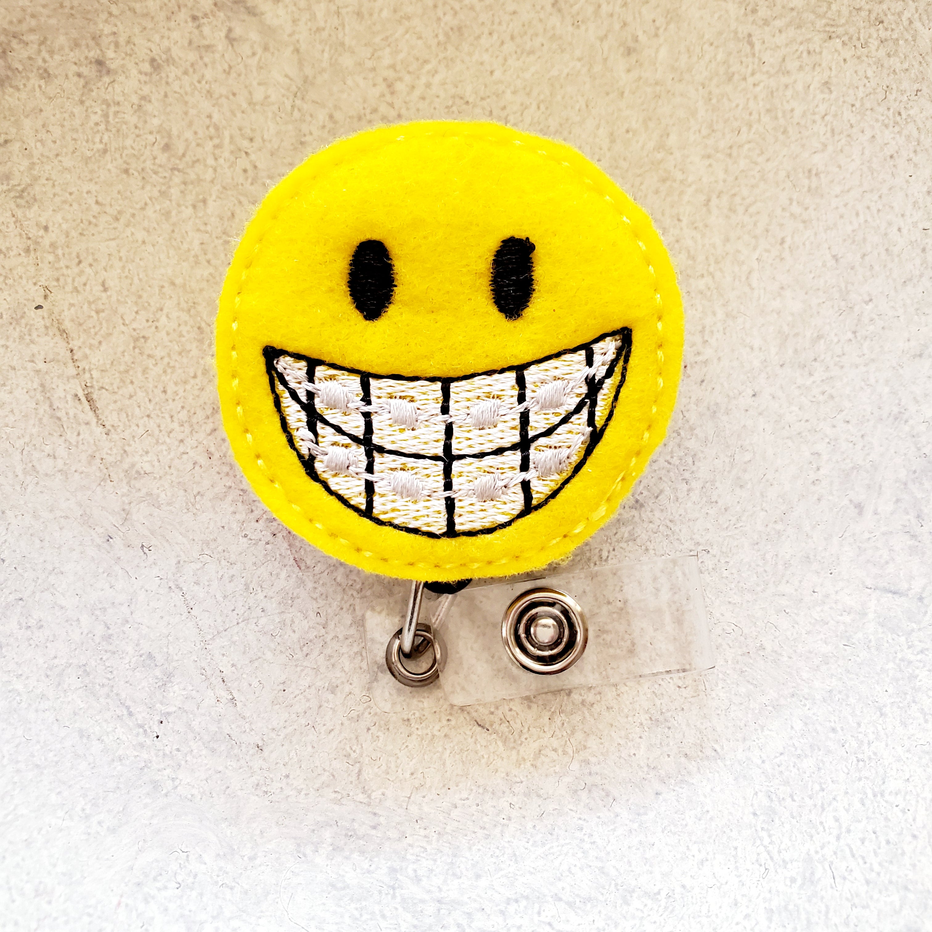 Felt – Smiley Face Braces Orthodontist Badge Topper + Reel - | Happie Potato Image 2