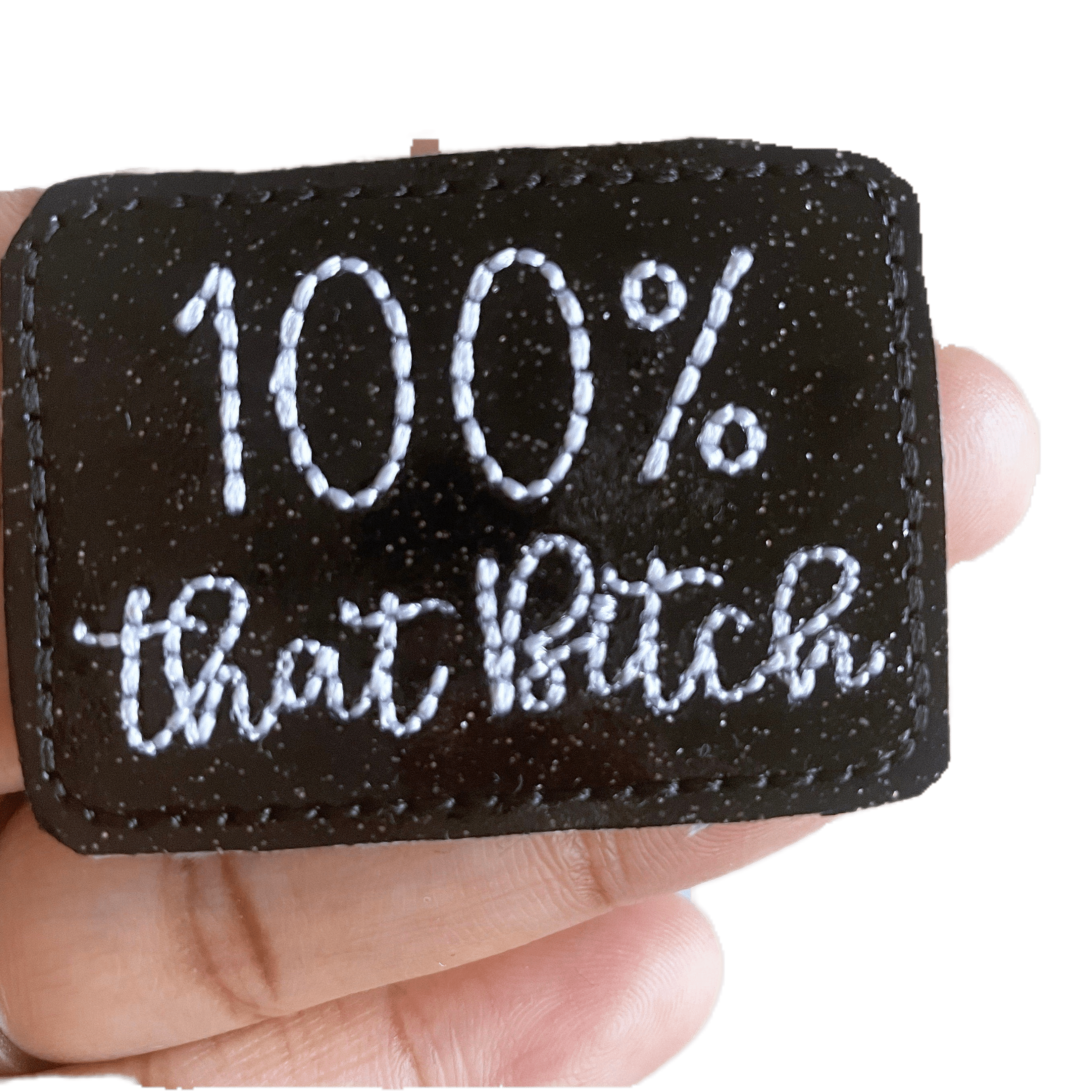 Vinyl 100% That Bitch Badge Topper + Reel - Clothing | Happie Potato Image 1