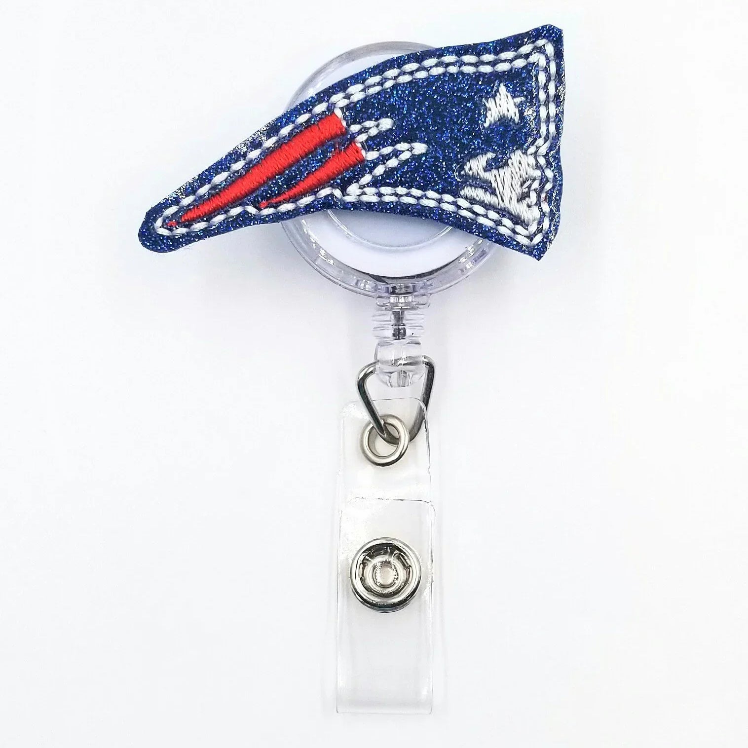 Sparkly blue badge reel with embroidered red, white, and silver patriotic flag design