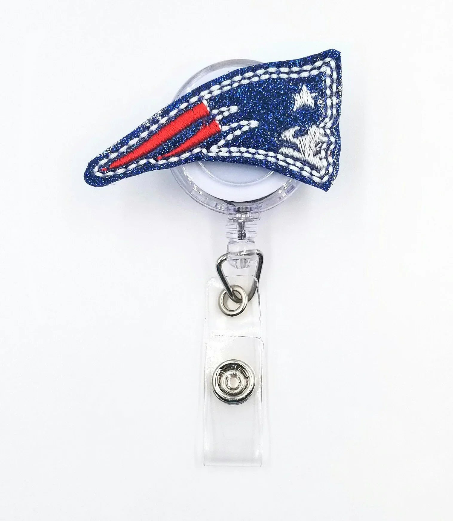 Sparkly blue badge reel with embroidered red, white, and silver patriotic flag design