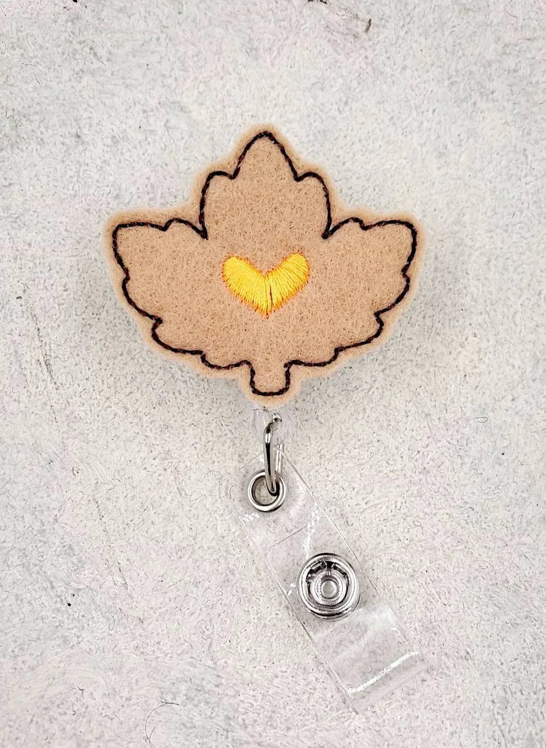 Felt maple leaf badge reel with yellow heart embroidery, cute accessory for nurses