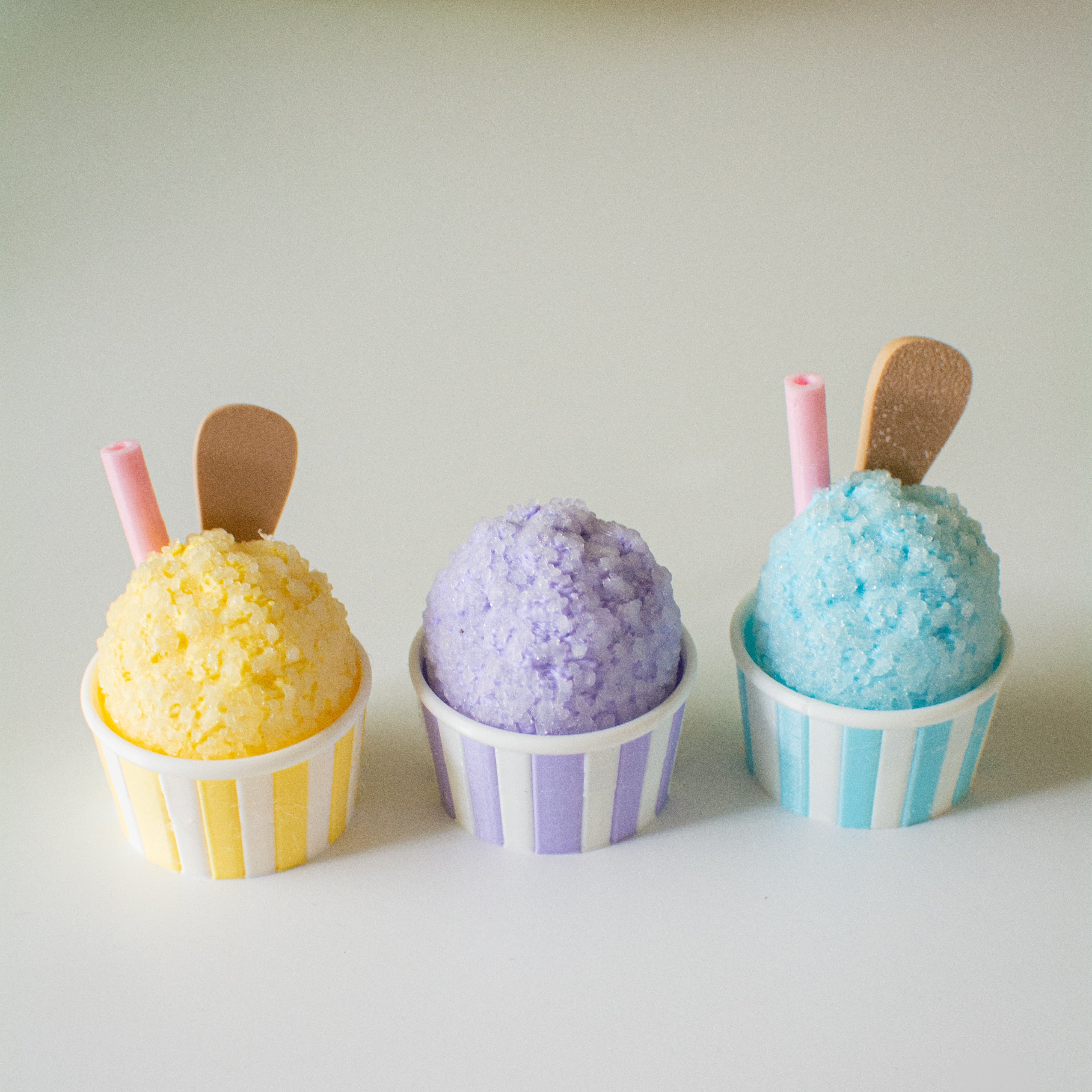 Three snocone fidgets with strip bases.